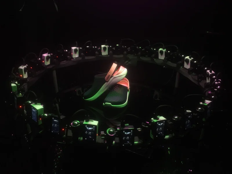Dark circular product capture array surrounding a shoe.