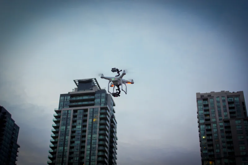 Phantom360 — Aerial camera equipment beside urban buildings.