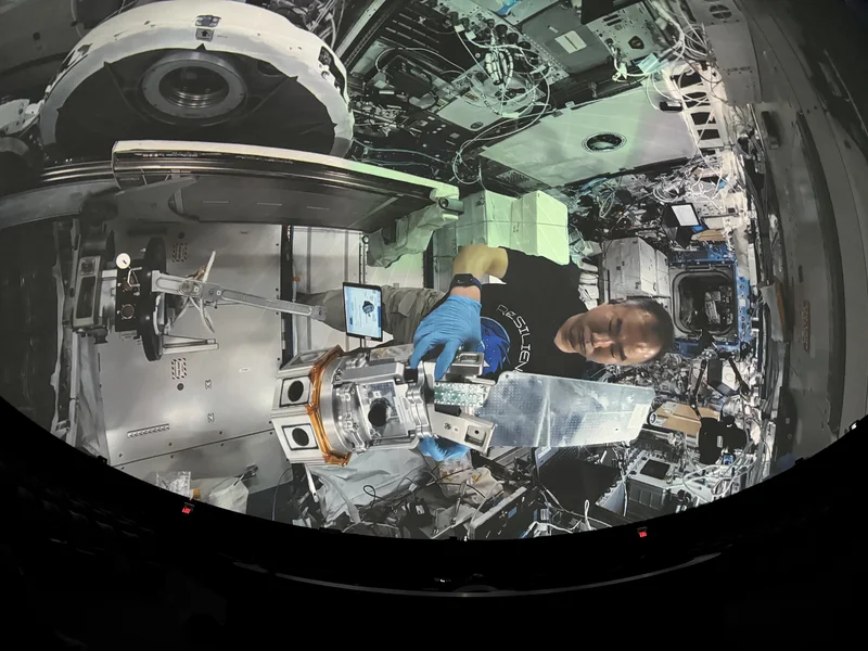 Dome theatre displaying space station footage.