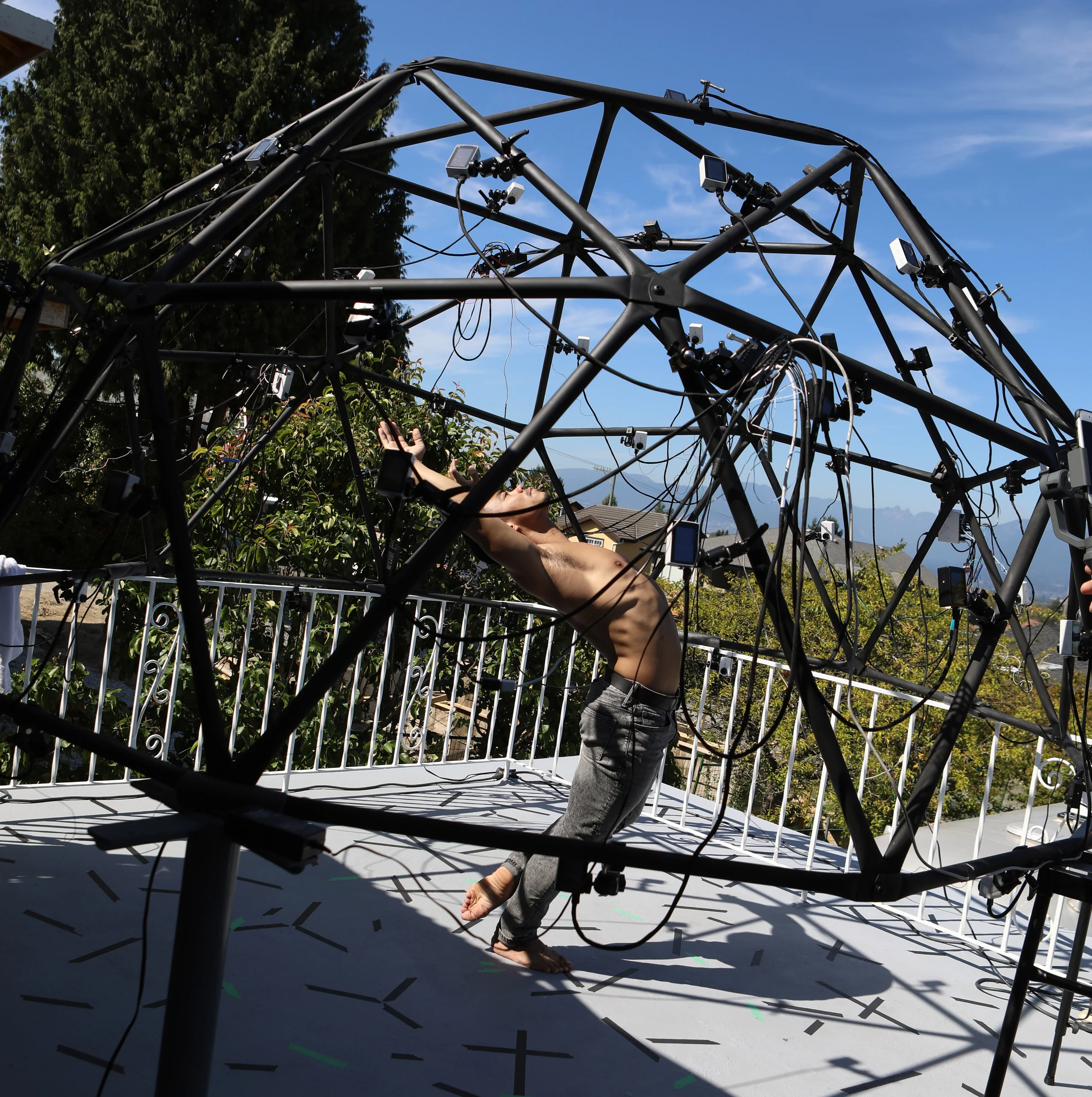 Jason Ignacio performs inside the camera array during the A/Re You There? capture session.
