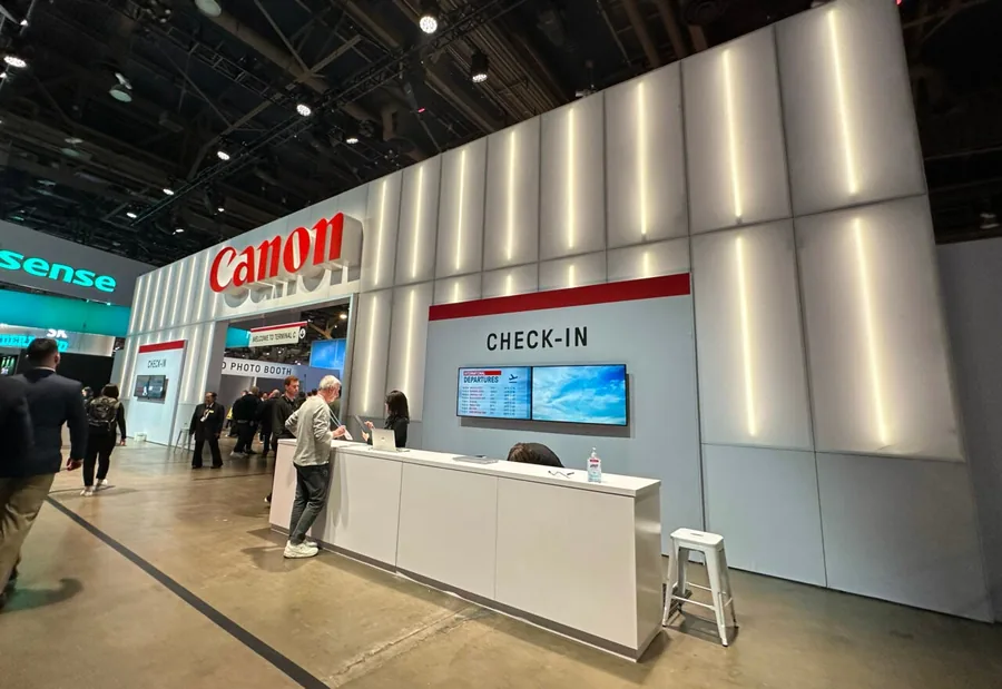 Canon’s airport-themed CES 2024 booth entrance and check-in counter.
