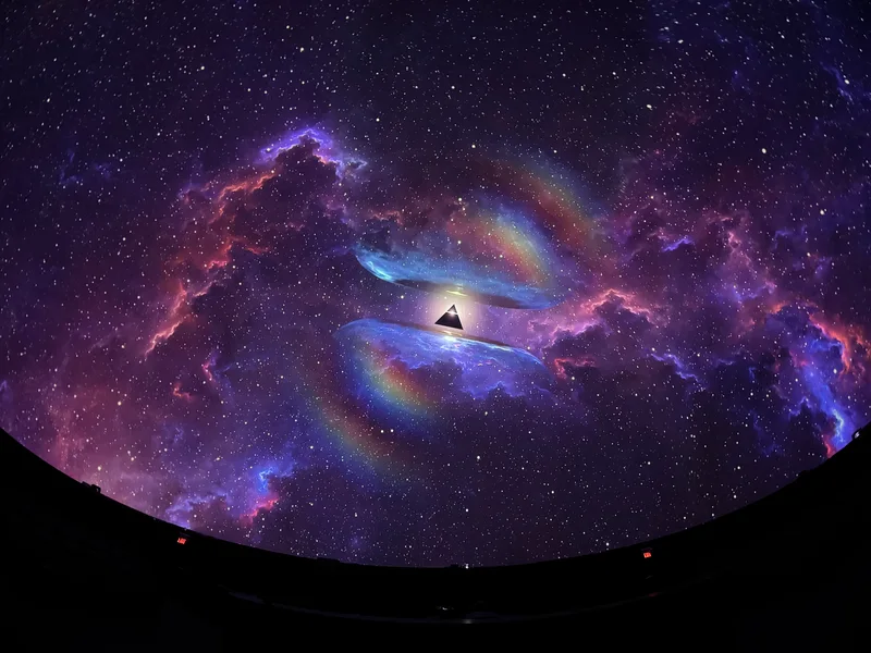 Dome theatre displaying colorful Pink Floyd projected art.