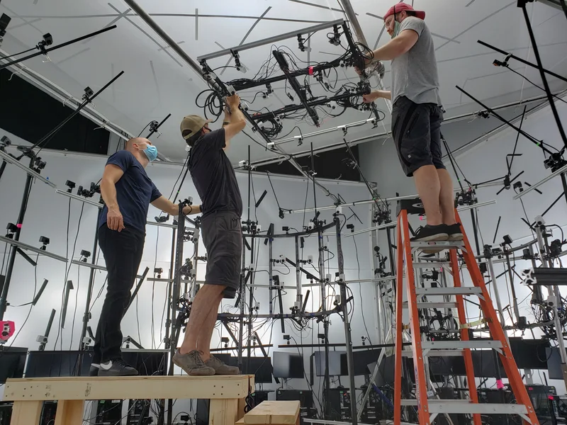 Crew assembling and adjusting the synchronized capture stage.