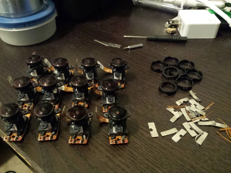 Bare camera sensors and lenses laid out for the prototype.