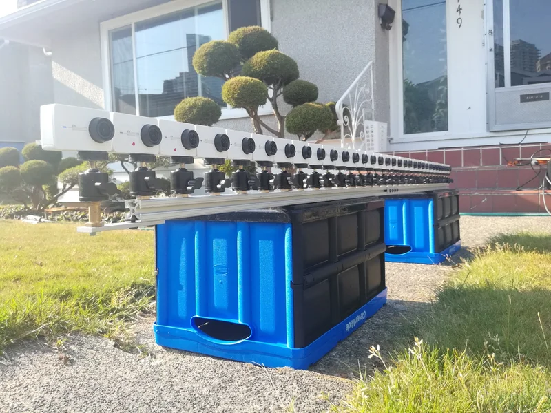 Long horizontal light-field camera array outdoors.
