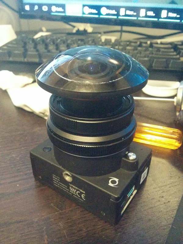 Fisheye camera/lens prototype mounted on articulated support.