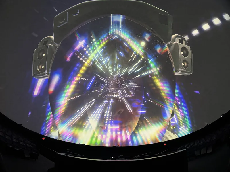 Dome theatre displaying colorful Pink Floyd projected art.