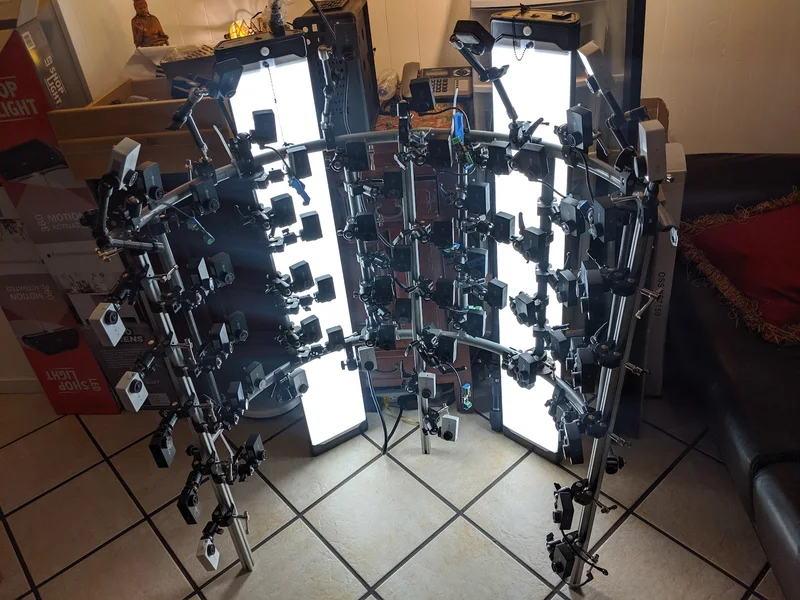 Compact vertical multi-camera grid with lights and supporting frame.
