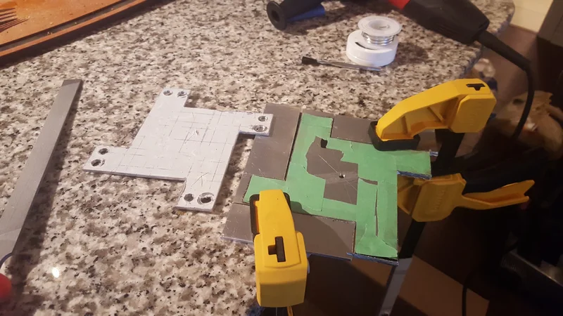 Clamped rough-build components during assembly.