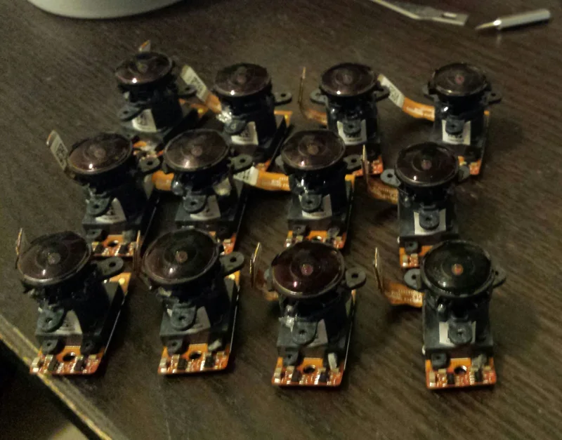 Collection of bare sensor and lens modules used for research camera build.