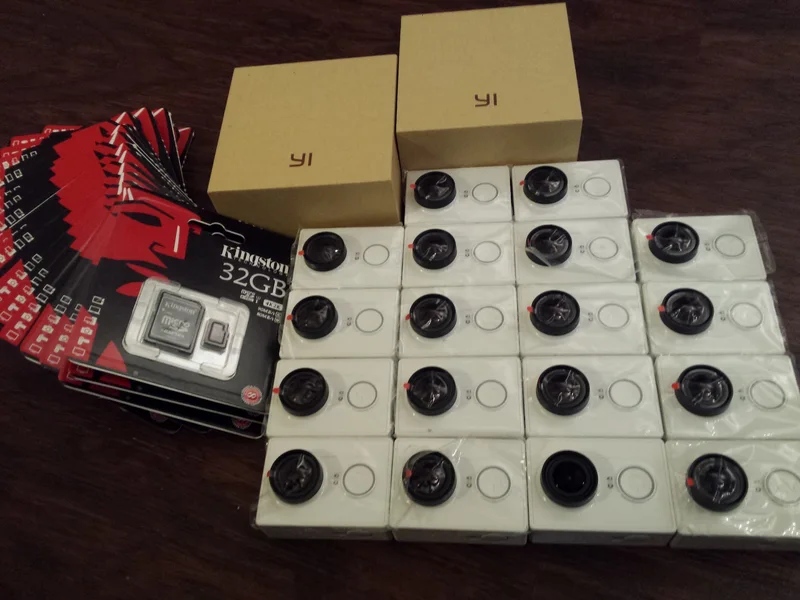 Consumer Yi cameras and storage media prepared for disassembly.
