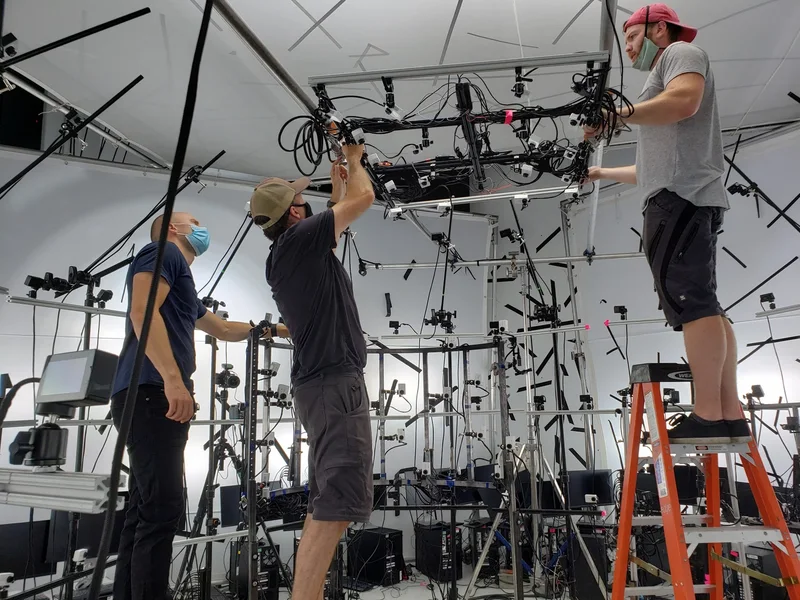 Crew constructing and adjusting the multi-camera capture stage.