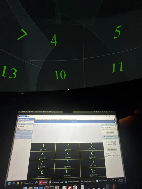 Laptop and Dome screen showing projector field calibration.