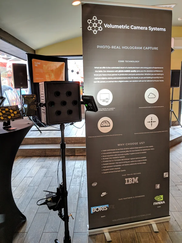 Compact VCS camera, screen and branded banner at the Canada House booth.