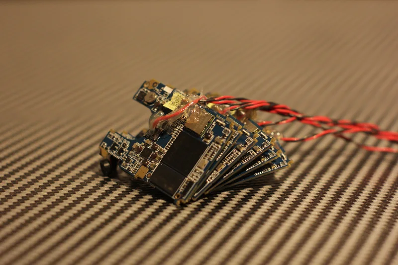 Close-up of stacked camera sensor/electronics boards with wires.
