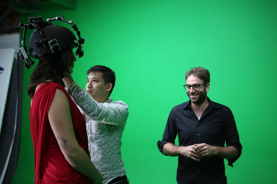 Setting up the head-mounted camera rig for a green-screen scene in Rose Colored.