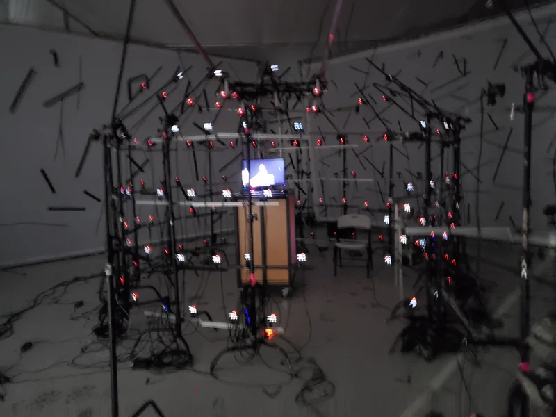 Demonic capture stage with synchronized camera rows and monitoring equipment.