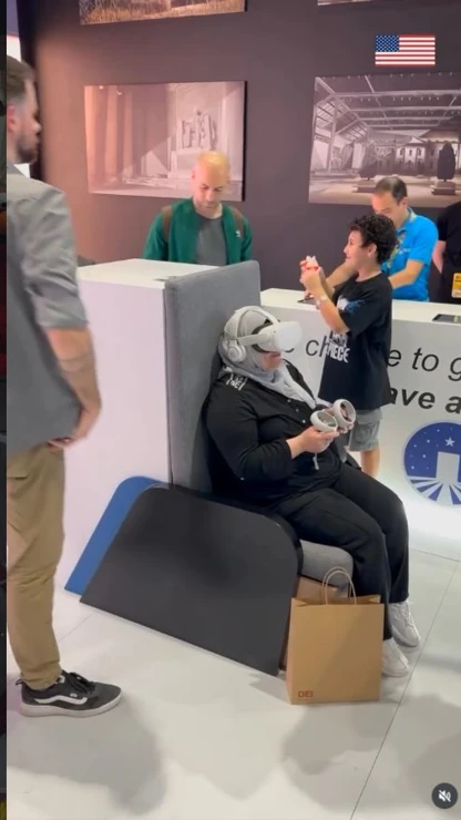 A visitor explores SuperMuseum in VR at the ComicCon booth — video frame. Source: U.S. Mission UAE.
