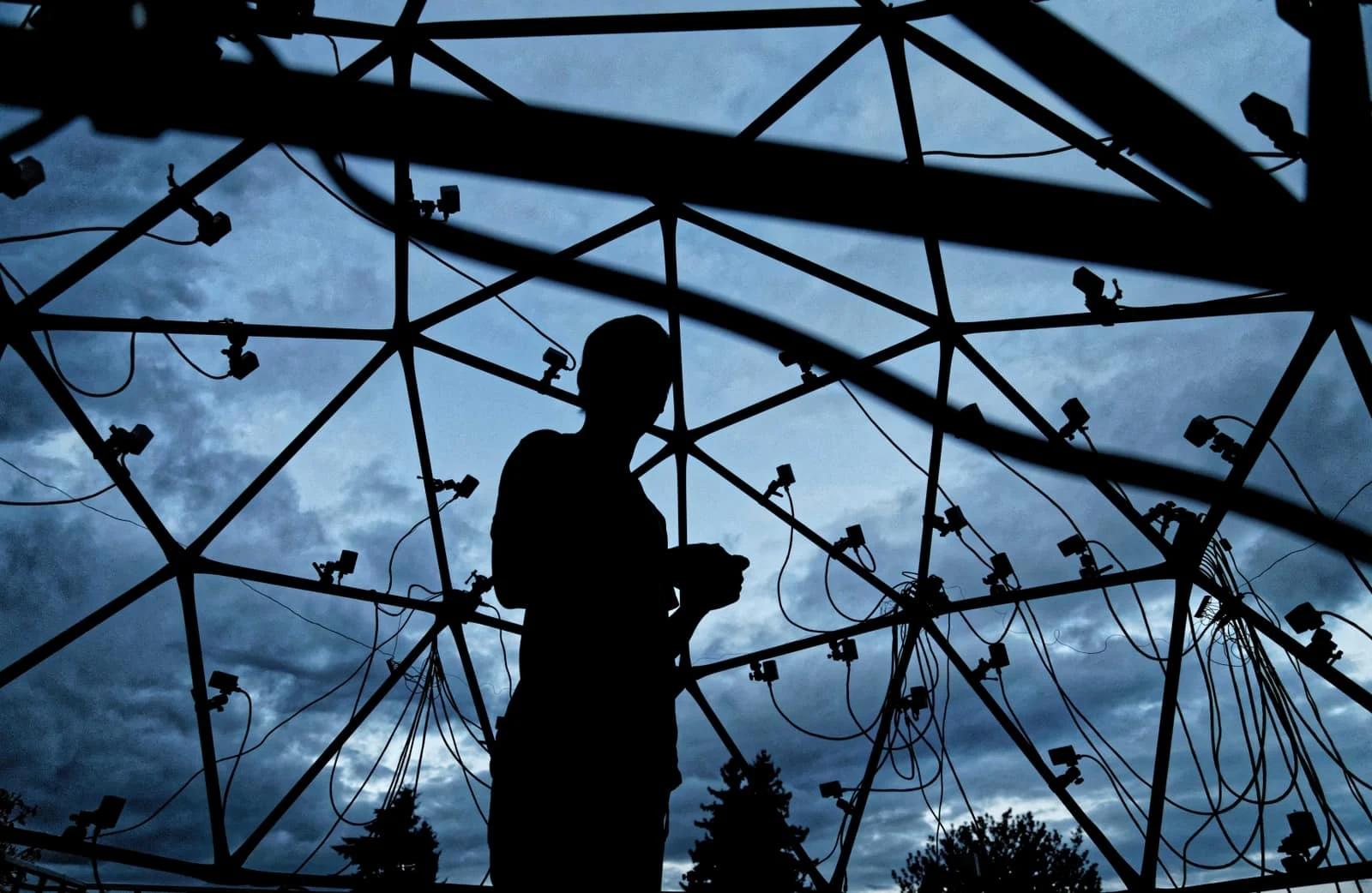 Custom volumetric capture dome with a silhouetted technician.