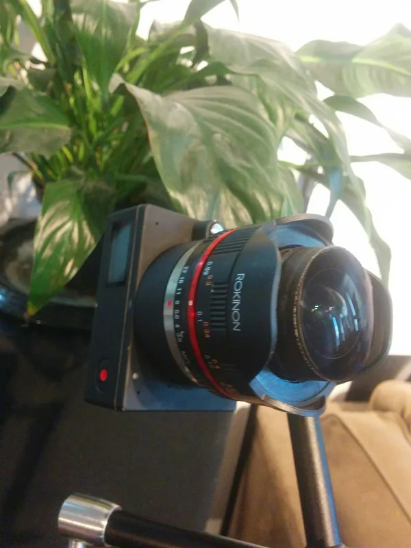 Custom camera/lens assembly on mount near window.