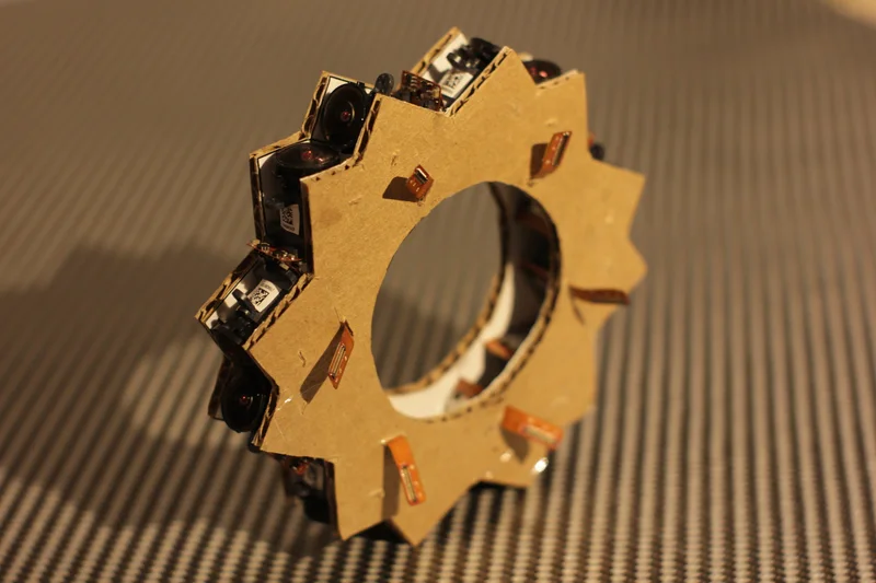 Close-up of laser-cut/cardboard ring mount with camera modules.