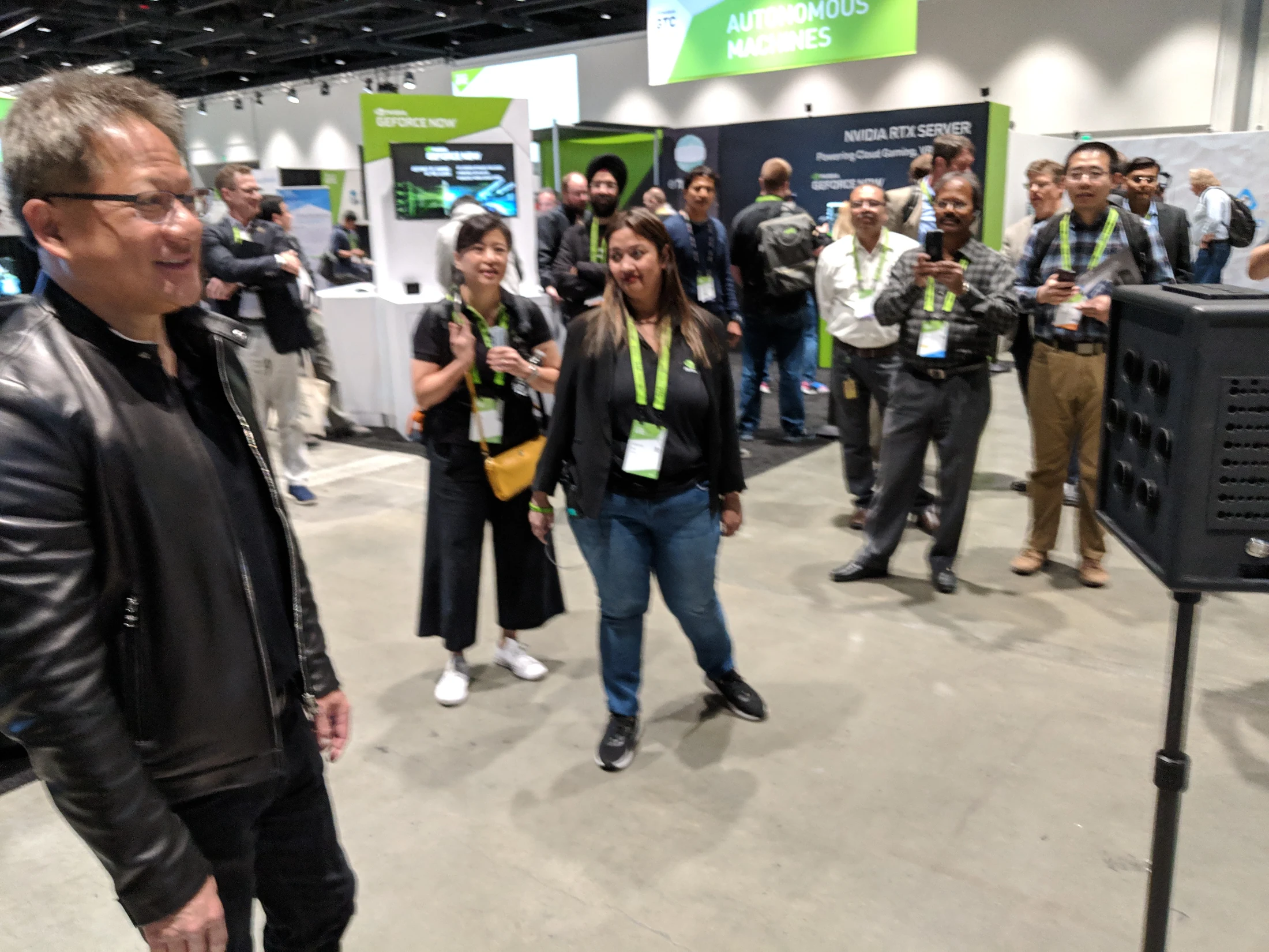Jensen Huang and attendees at the compact-camera demo.
